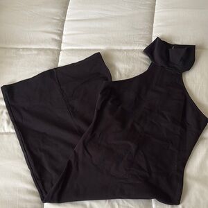 Black Sleeveless Turtleneck Top
